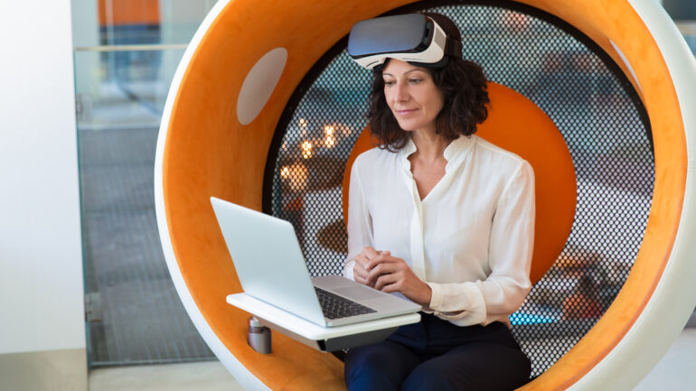 Businesswoman with taken off VR headset