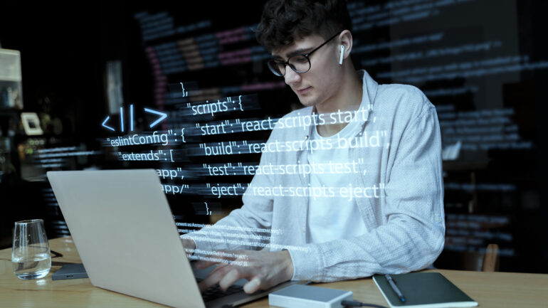 programming-background-with-person-working-with-codes-computer (1)