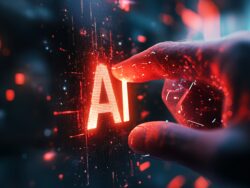 A hand reaching towards glowing “AI” letters, symbolizing technology and innovation.