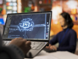 Call center worker using AI tech on laptop to reply to customers, closeup