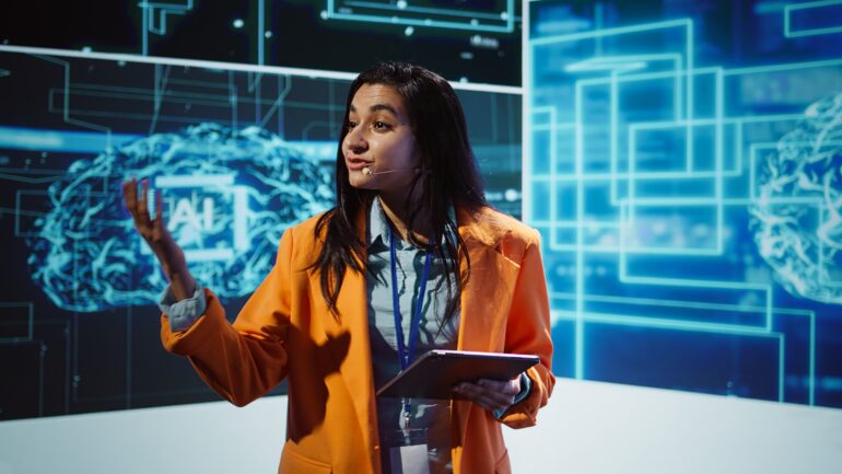 Public speaker doing presentation at tech forum event